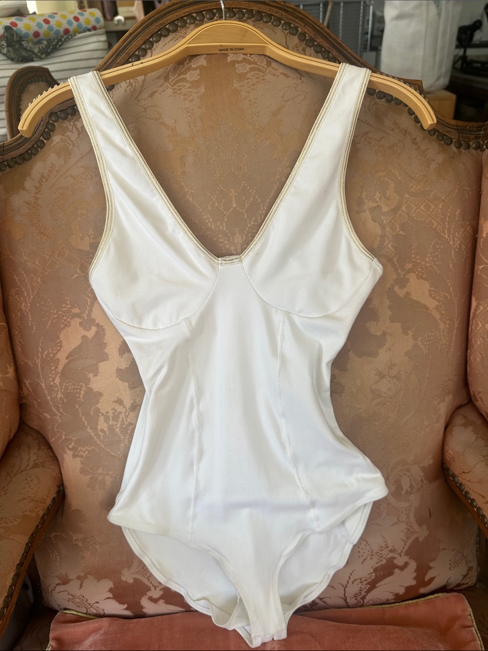 Top as bodysuit Athletic fabric stretches Gold trim ribbon Showroom sample as is